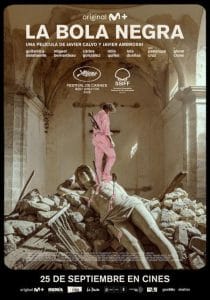 Movie poster for La bola negra, featuring a young man in pink standing on a fallen classical statue amidst ruins.
